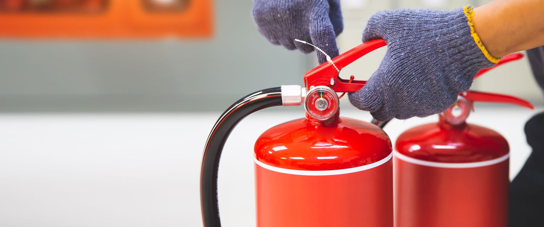 Engineer inspecting extinguisher